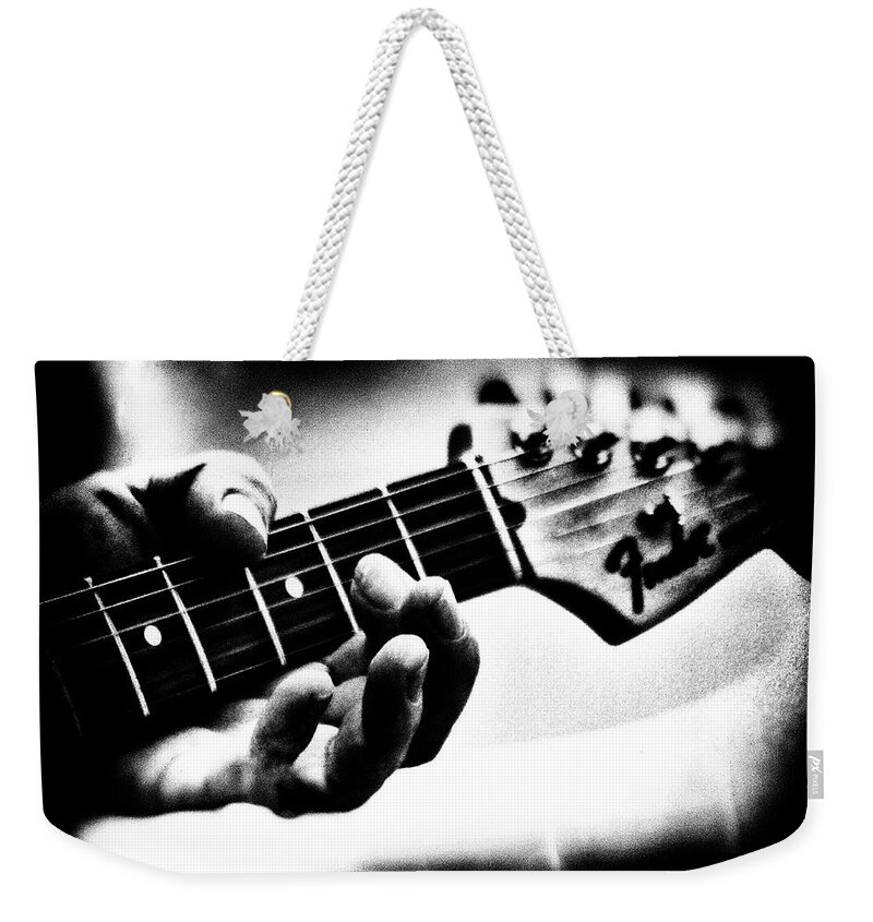 Fender Weekender Tote Bag featuring the photograph Fender Strat by Bob Orsillo