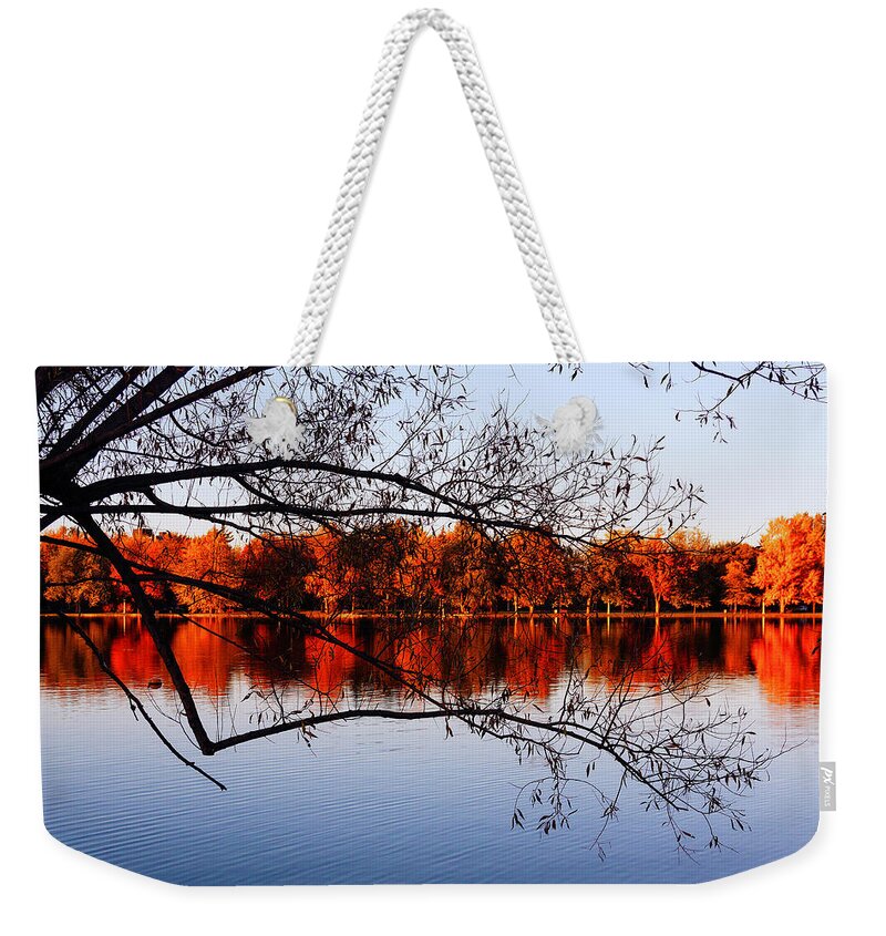 Fiery Colors Weekender Tote Bag featuring the photograph Fiery colors on the lake by Tatiana Travelways