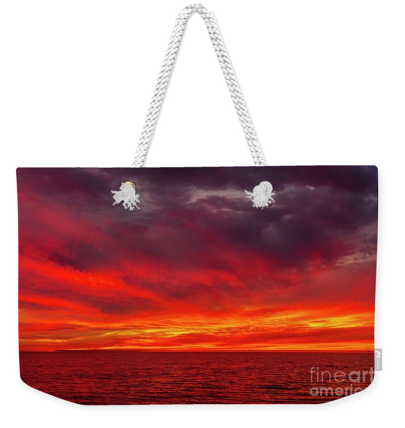 Sunset Weekender Tote Bag featuring the photograph Fiery Sunset in Oceanside - January 10, 2022 by Rich Cruse
