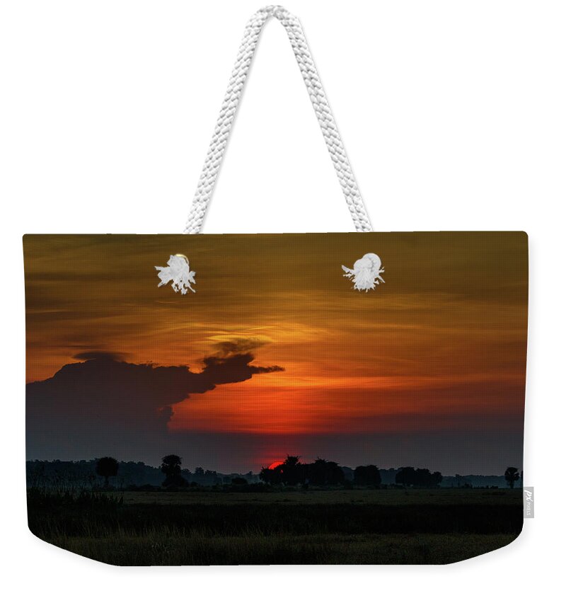 Sunrise Weekender Tote Bag featuring the photograph First Light by Les Greenwood