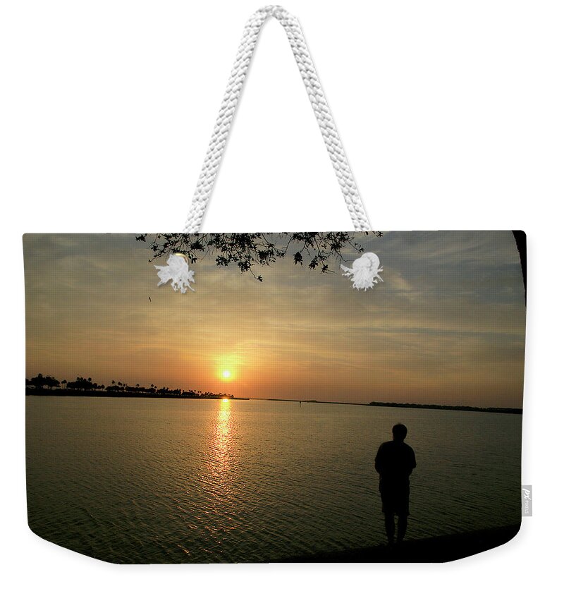 Sunset Weekender Tote Bag featuring the photograph Fishing at Sunset by Chauncy Holmes