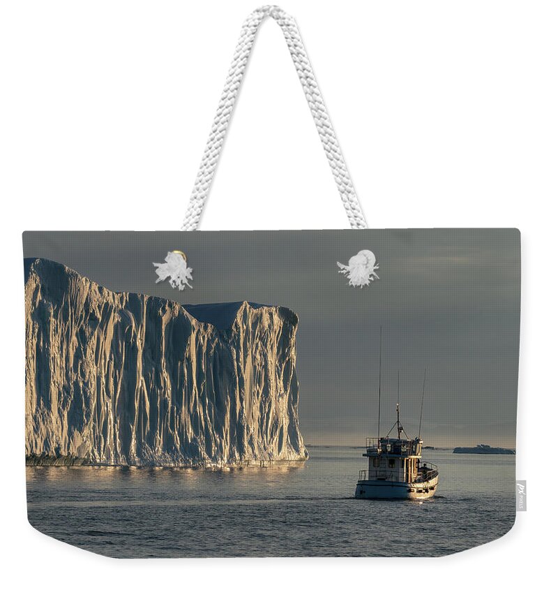 Disco Bay Weekender Tote Bag featuring the photograph Fishing boat in Disco bay by Anges Van der Logt