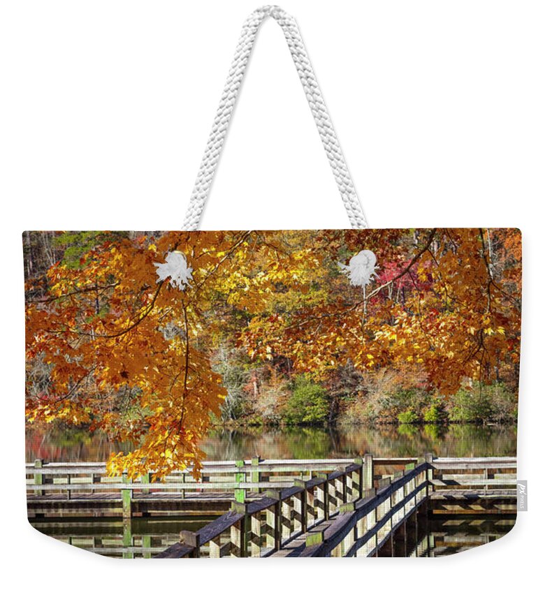 Carolina Weekender Tote Bag featuring the photograph Fishing Dock under the Maple Trees by Debra and Dave Vanderlaan