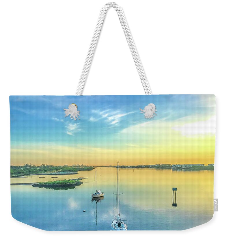 Boats Weekender Tote Bag featuring the photograph Floating on Morning Clouds by Debra and Dave Vanderlaan