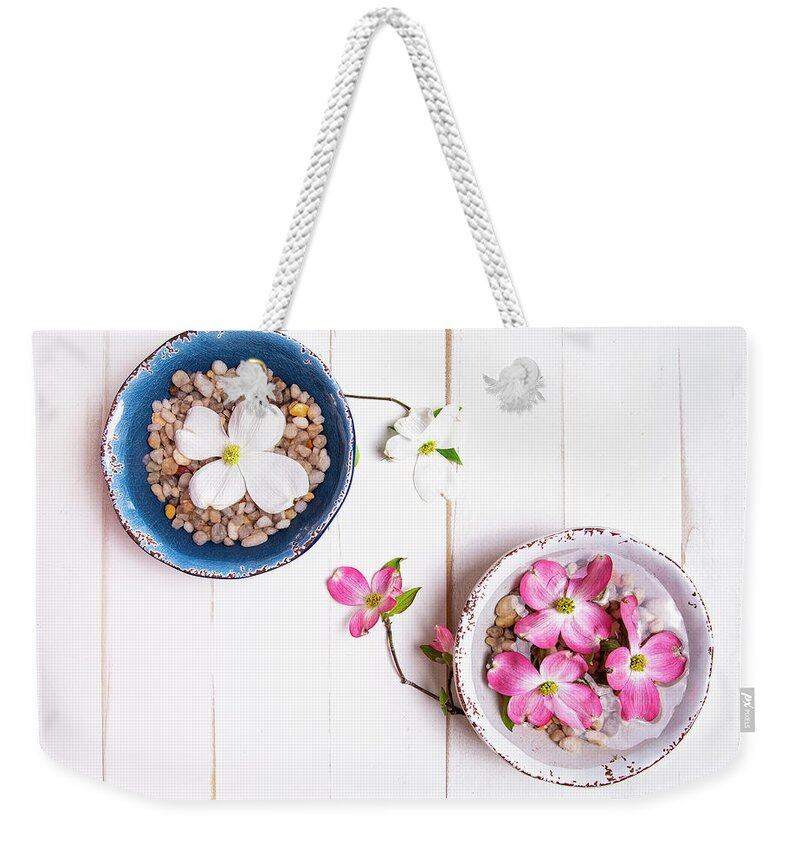 North Wilkesboro Weekender Tote Bag featuring the photograph Floating Pink and White Dogwood Blooms by Charles Floyd