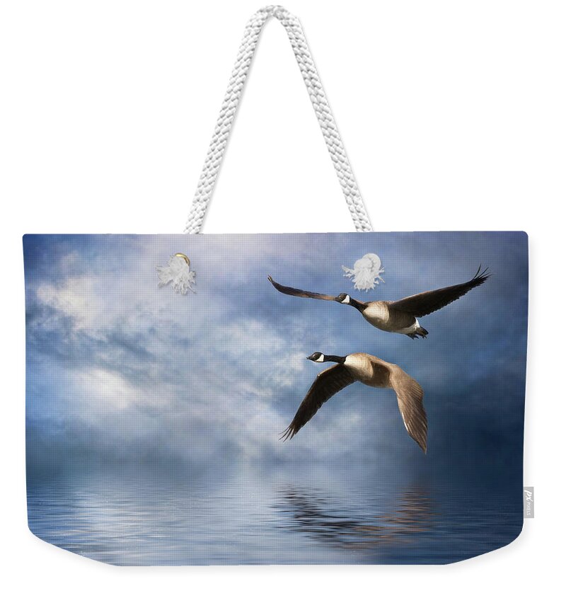 Geese Weekender Tote Bag featuring the digital art Flying Home by Nicole Wilde
