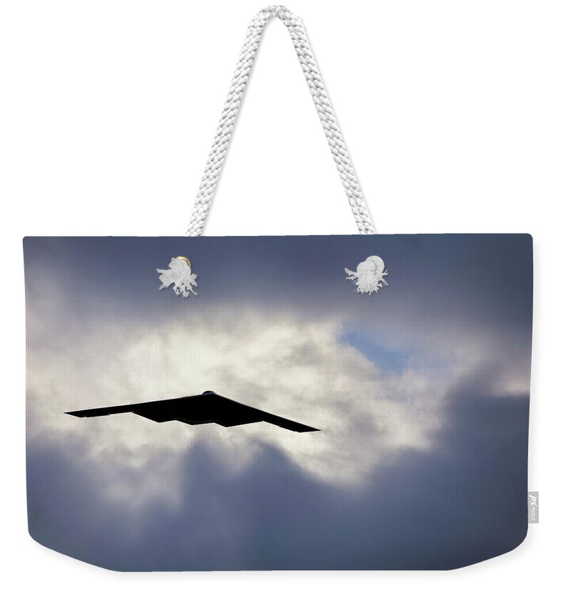 B2 Weekender Tote Bag featuring the photograph Flying out of the Clouds - B-2 Stealth Bomber - Air Force Pilot by Jason Politte