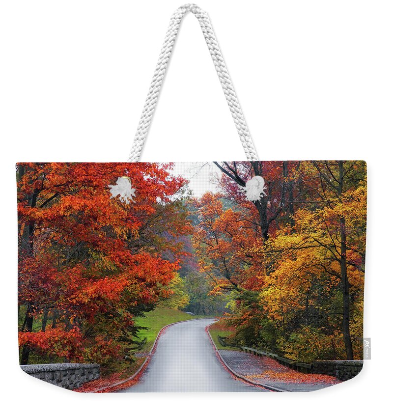 Autumn Weekender Tote Bag featuring the photograph Majestic Autumn Road by Jessica Jenney