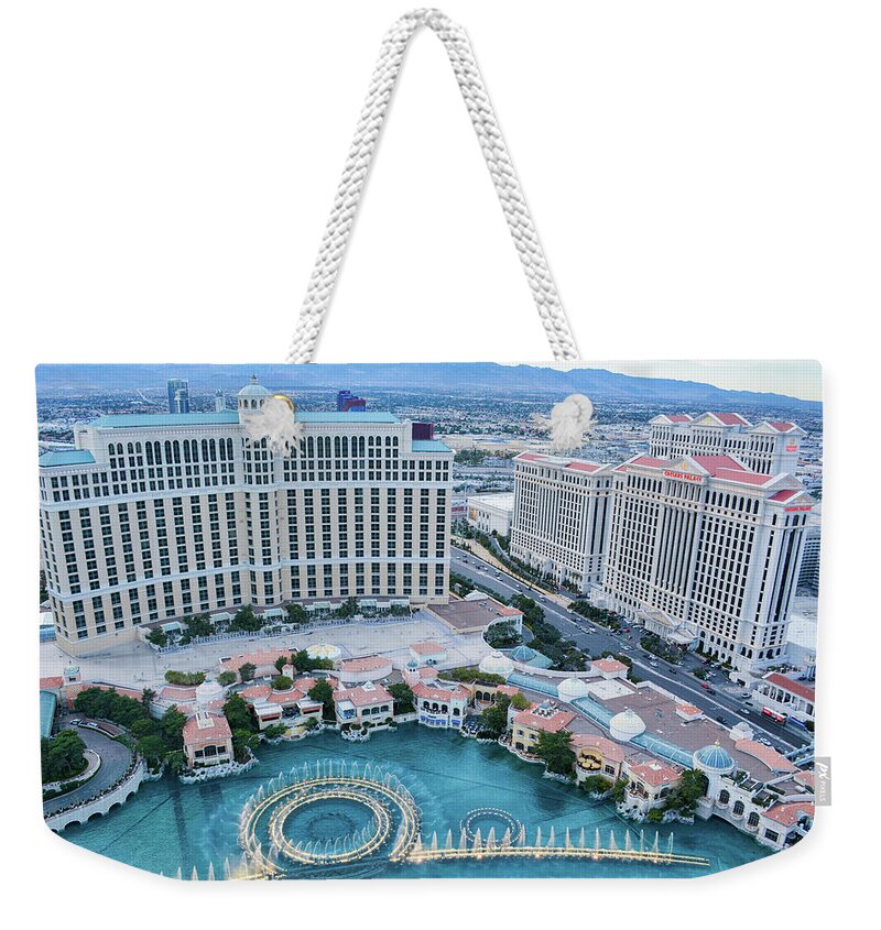 Eiffel Tower Experience Weekender Tote Bag featuring the photograph Fountains of Bellagio Evening by Kyle Hanson