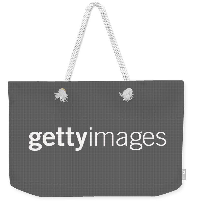 Getty Images Logo Weekender Tote Bag featuring the digital art Getty Images White Logo by Getty Images