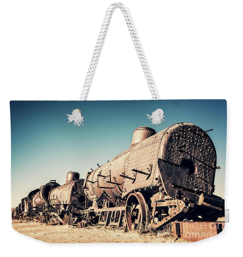Train Weekender Tote Bag featuring the photograph Ghost train in Uyuni, Bolivia by Delphimages Photo Creations