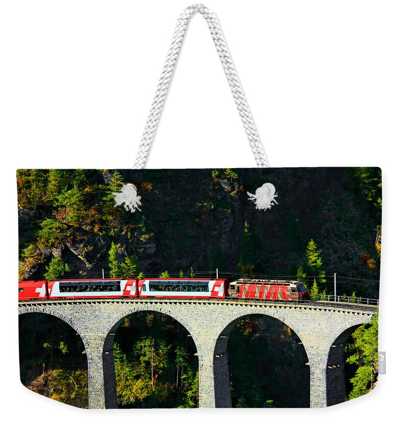 Glacier Express Weekender Tote Bag featuring the photograph Glacier Express on the Landwasser Viadukt by Steve Ember