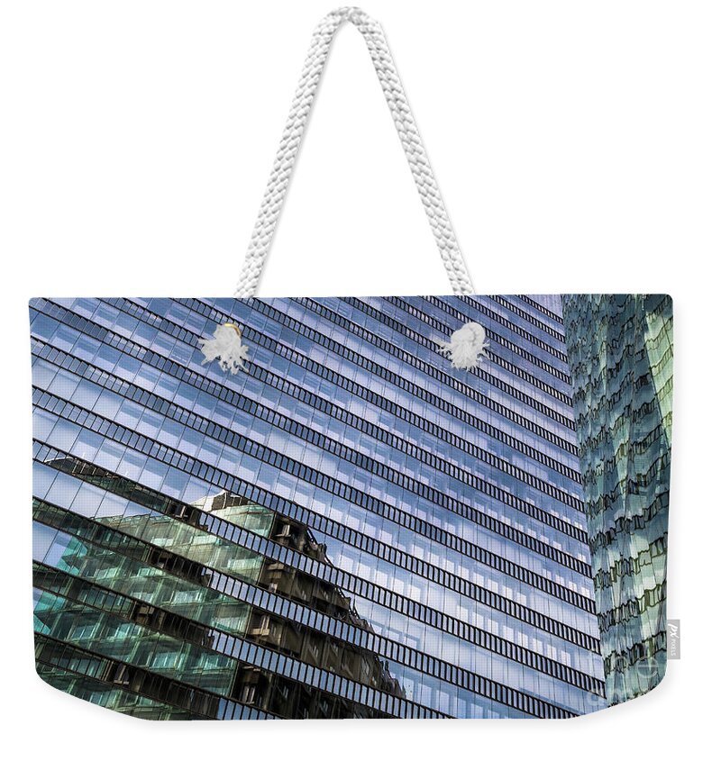 Accommodation Weekender Tote Bag featuring the photograph Glass Facade Of Modern Office Buildings by Andreas Berthold