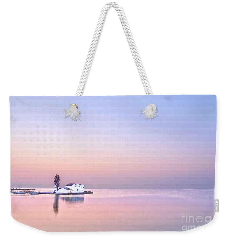 Sunrise Tree White Haven House Single Lonely Loneliness Alone Solo Solitary Relaxation Blue Sky Pink Sea Creative Unwinding Calm Serene Tranquillity Untroubled Minimalist Stylish Minimalism Glorious Impression Impressionistic Landscape Scenic Mindfulness Singular Charming Atmospheric Aesthetic Dawn Sentimental Delicate Gentle Evocative Panoramic Unspoiled Peaceful Tranquility Morning Simplicity Pastel Watercolor Conceptual Expressive Serenity Inspirational Magic Poetic Delightful Simple Seascape Weekender Tote Bag featuring the photograph Singled out at sea, Glorious dawn at sea Greece, Corfu calm and tranquility before sunrise by Tatiana Bogracheva