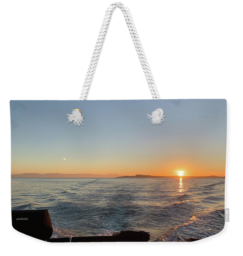  Weekender Tote Bag featuring the photograph Going Home by Tim Dussault