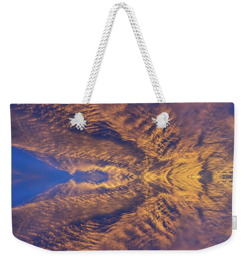 Clouds Weekender Tote Bag featuring the digital art Golden clouds in the dark blue sky, guardian angel by Adriana Mueller