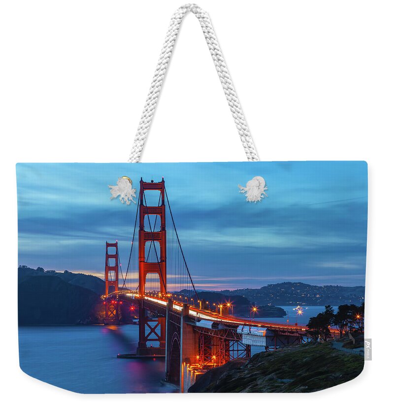 Shoreline Weekender Tote Bag featuring the photograph Golden Gate At Nightfall by Jonathan Nguyen