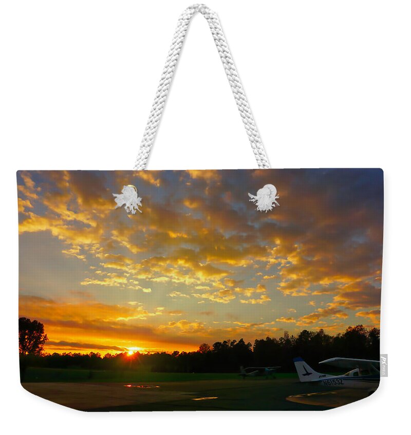 Sunset Weekender Tote Bag featuring the photograph Golden Shimmer Sunset at JAARS Airport by Daniel Brinneman