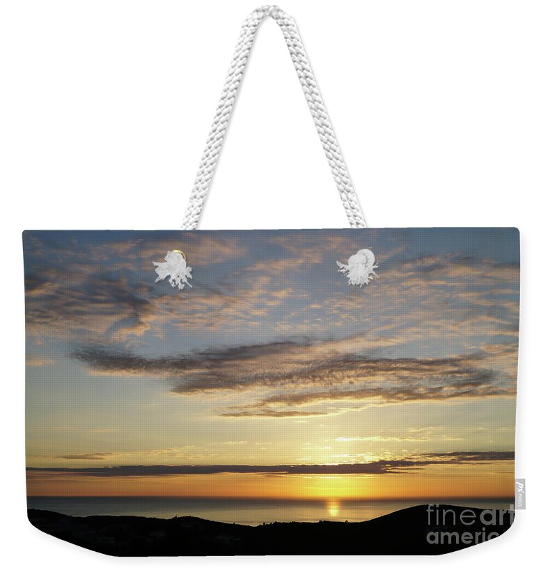 Clouds Weekender Tote Bag featuring the photograph Golden sunlight on the coast by Adriana Mueller