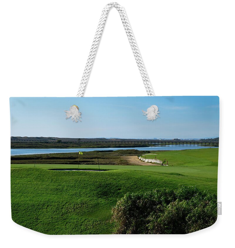 Golf Course Weekender Tote Bag featuring the photograph Golf course and Ria Formosa in Quinta do Lago by Angelo DeVal