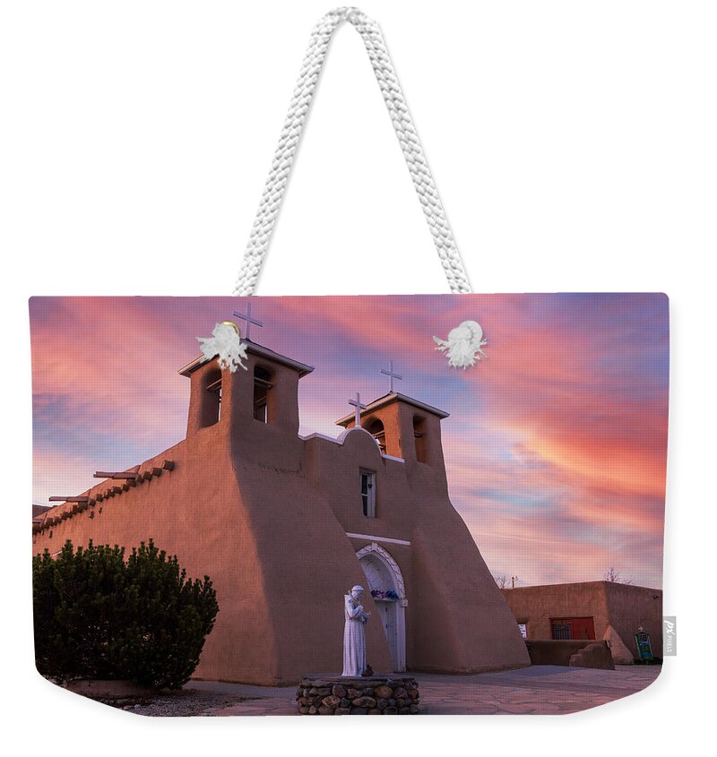 Taos Weekender Tote Bag featuring the photograph Gorgeous Sunset with the St Francisco de Asis Church by Elijah Rael