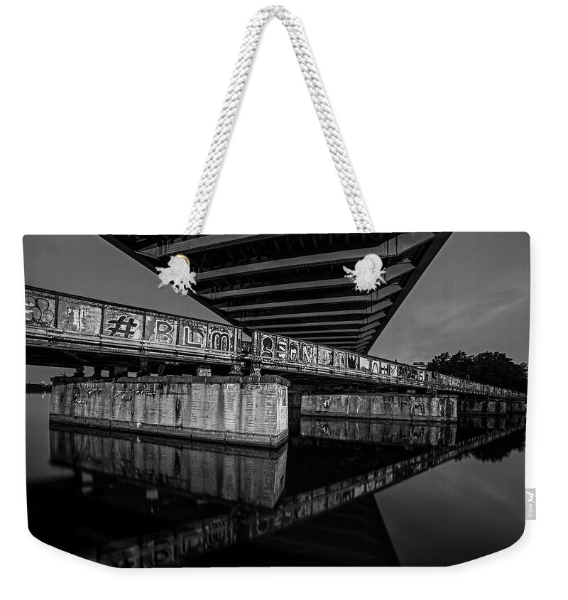 Boston Weekender Tote Bag featuring the photograph Graffiti Under the BU Bridge Boston MA Charles River Reflection Black and White by Toby McGuire