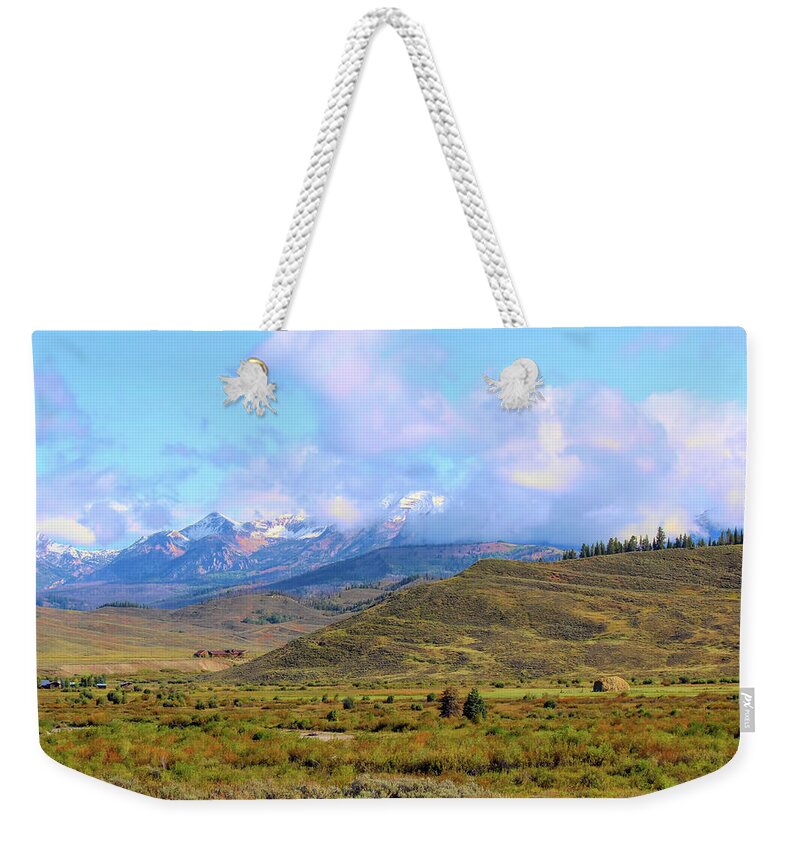 Grand Tetons Weekender Tote Bag featuring the photograph Grand Tetons in the clouds 1a by Cathy Anderson