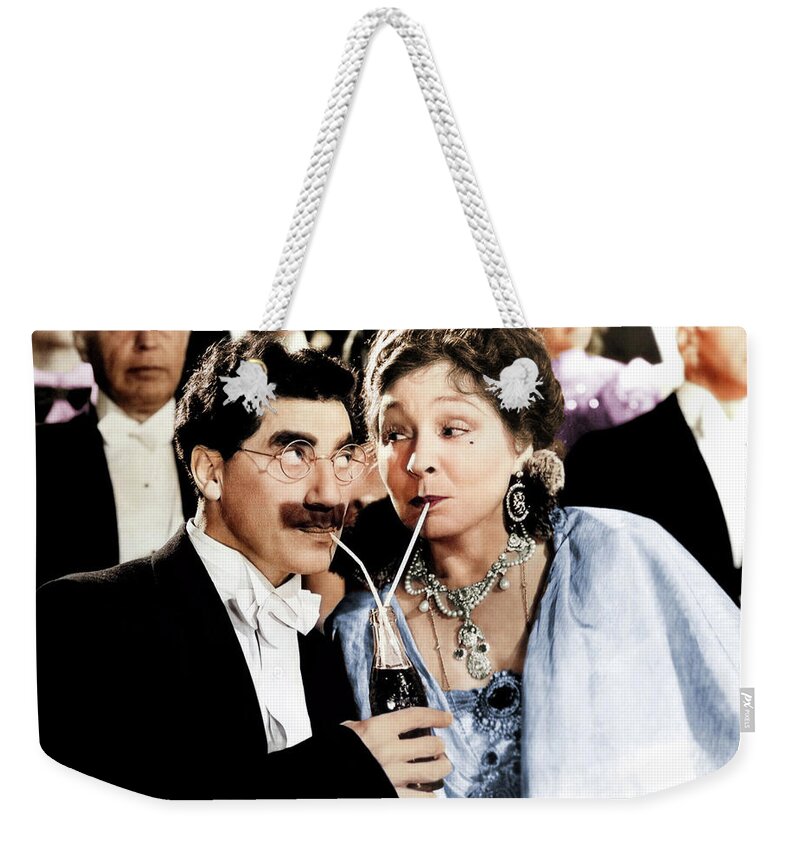 Groucho Marx Weekender Tote Bag featuring the photograph Groucho Marx and Margaret Dumont by Movie World Posters