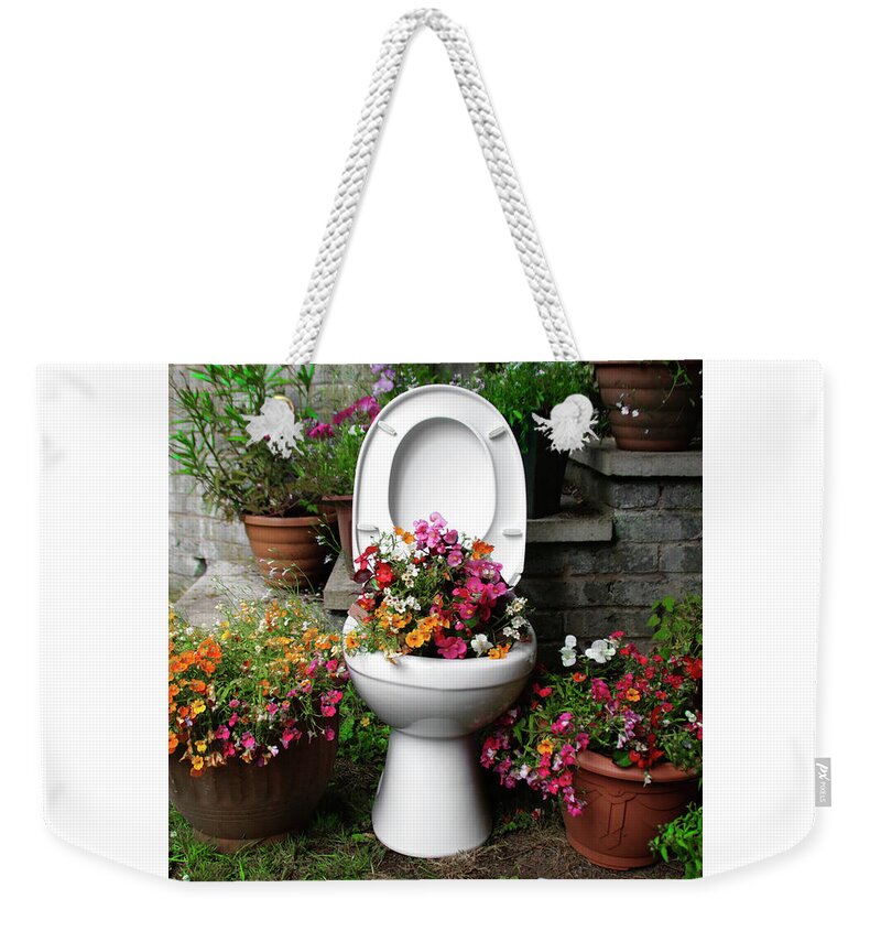 Toilet Weekender Tote Bag featuring the photograph Growing a Little Potty in the Garden by Doc Braham
