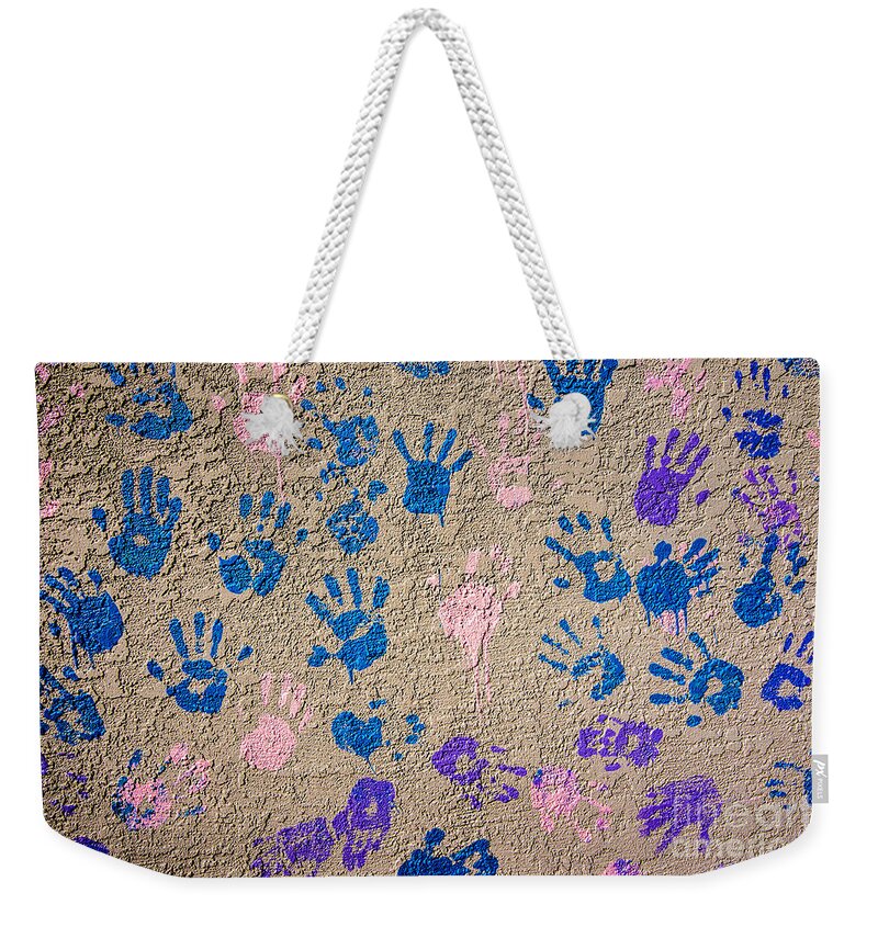 Hand Prints Weekender Tote Bag featuring the photograph Hand Prints - Painted Hands on Concrete - Abstract by Gary Whitton