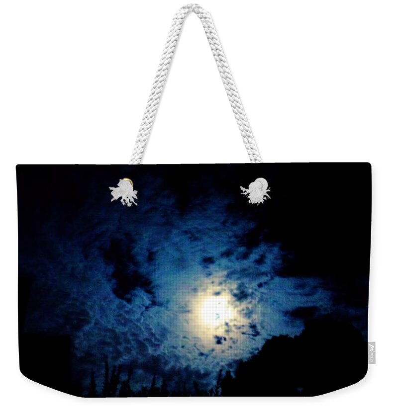 Moon Weekender Tote Bag featuring the photograph Harvest Moon in the Clouds by Christopher Reed