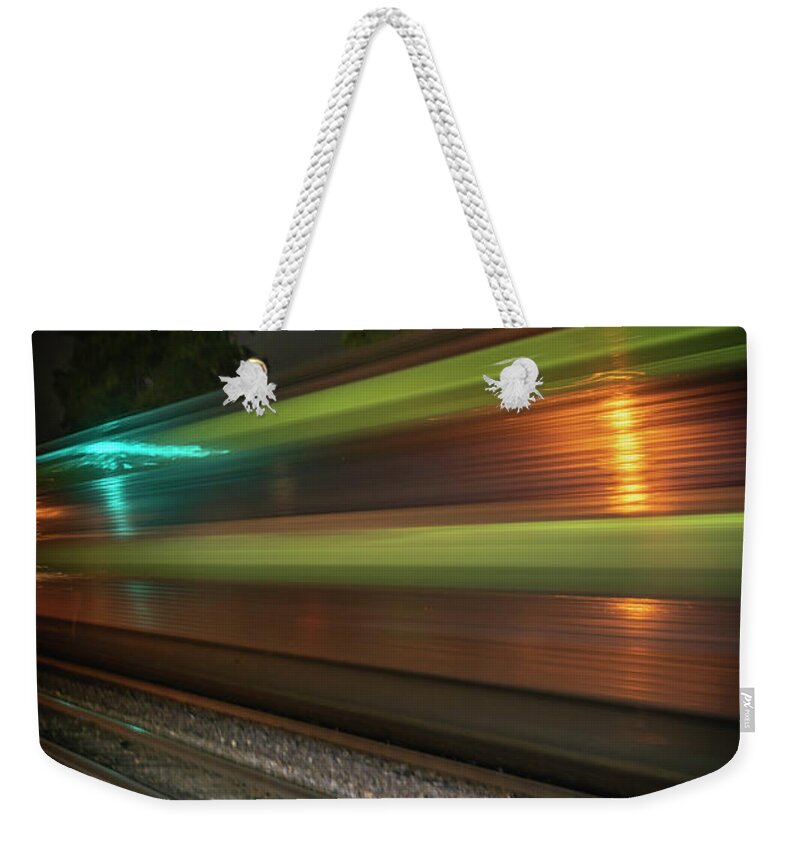 Metra Weekender Tote Bag featuring the photograph Heading Out or Heading In by Laura Hedien