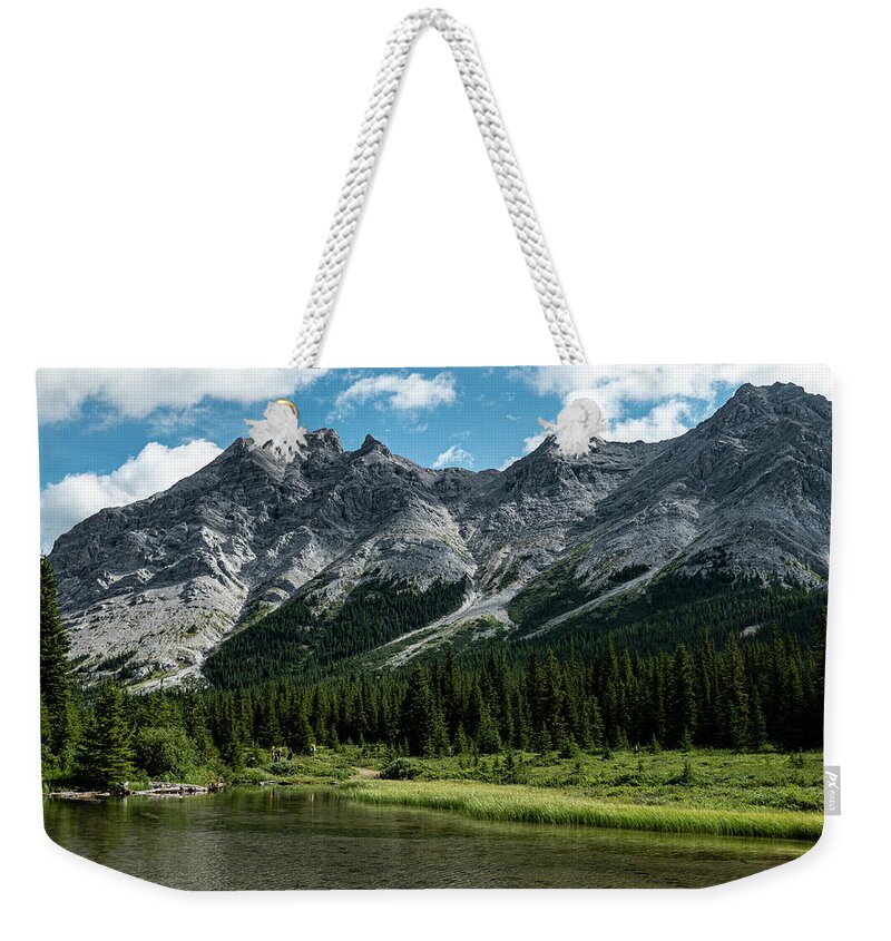 River Weekender Tote Bag featuring the photograph headwaters of the Elbow River by Karen Rispin