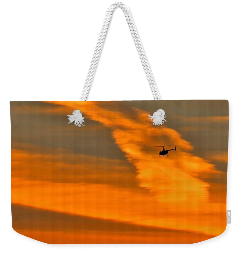 Helicopter Weekender Tote Bag featuring the photograph Helicopter Approaching at Sunset by Linda Stern