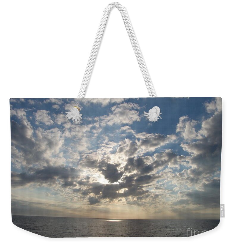 #gulfofmexico #underway #highseas #evening #dusk #sunset #clouds #cloudy #blueskies #sprucewoodstudios Weekender Tote Bag featuring the photograph Hiding in the Sky Cotton by Charles Vice
