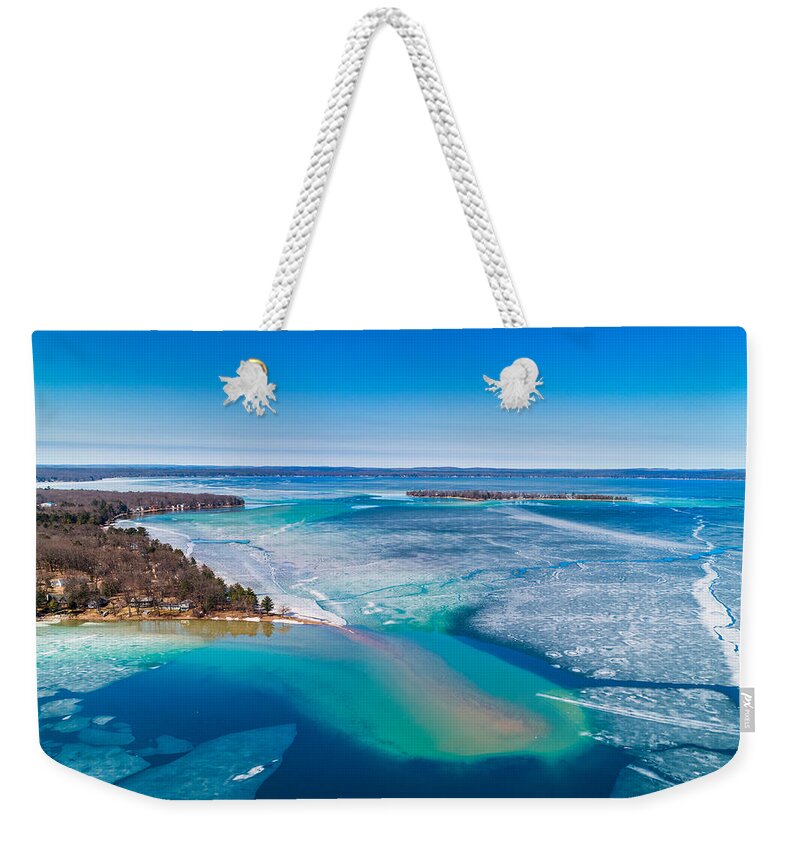 Higgins Lake Weekender Tote Bag featuring the photograph Higgins Lake Spring Ice Thaw by Ron Wiltse