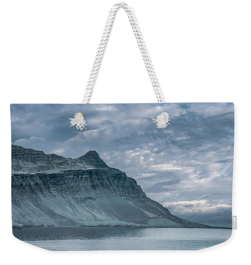  Weekender Tote Bag featuring the photograph High and Lofty Along the Coast of Iceland by Marcy Wielfaert