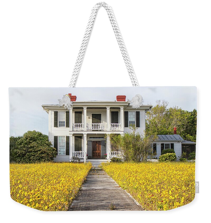 Beaufort Weekender Tote Bag featuring the photograph HIstoric Home With Yard of Wildflowers - Beaufort North Carolina by Bob Decker