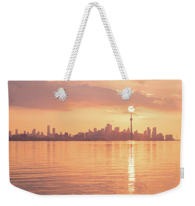 Perfectly Timed Weekender Tote Bag featuring the photograph Holding Up the Sun - Perfectly Timed Rose Gold Sunrise Over Toronto by Georgia Mizuleva