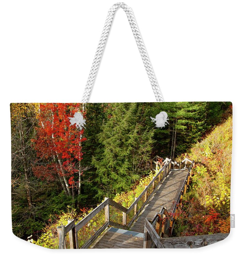 Au Sable River Weekender Tote Bag featuring the photograph Huron Manistee National Forest in Michigan with fall colors by Eldon McGraw