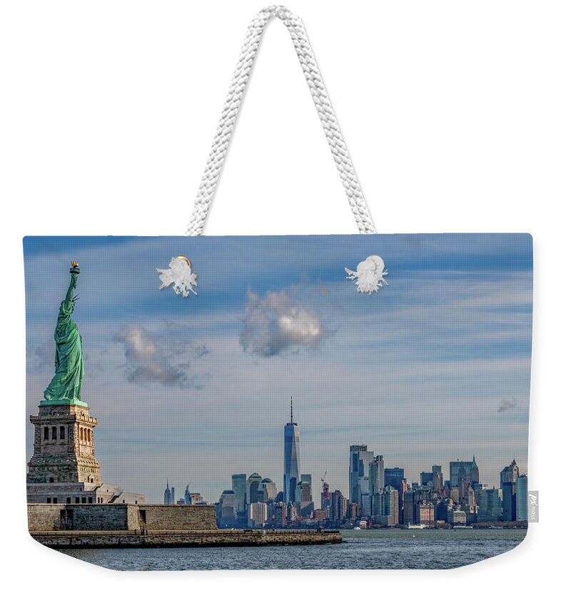 Nyc Weekender Tote Bag featuring the photograph I Lift My Lamp... by Marcy Wielfaert