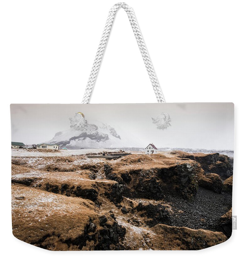 Arnarstapi Weekender Tote Bag featuring the photograph Lonely house in winter Iceland #1 by Michalakis Ppalis