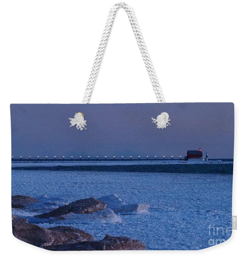 Grand Haven South Pierhead Outer Lighthouse Weekender Tote Bag featuring the photograph Icy Lights of the Grand Haven South Pierhead Outer Lighthouse by Tony Lee