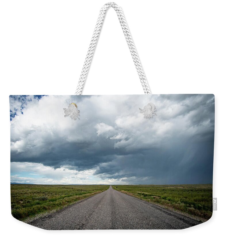 Storm Weekender Tote Bag featuring the photograph Idaho Stormy Road by Wesley Aston