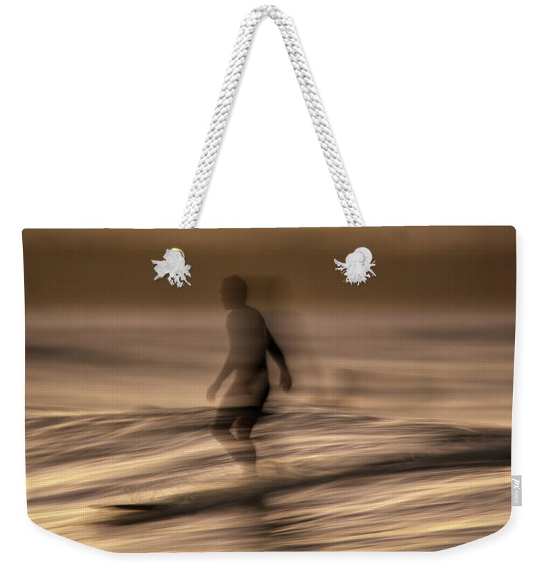 Surf Weekender Tote Bag featuring the photograph In motion by Nicolas Lombard
