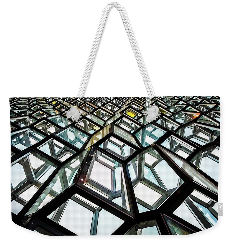 Harpa Concert Hall Weekender Tote Bag featuring the photograph Interior of Harpa Concert Hall in Reykjavik Iceland by Alexios Ntounas