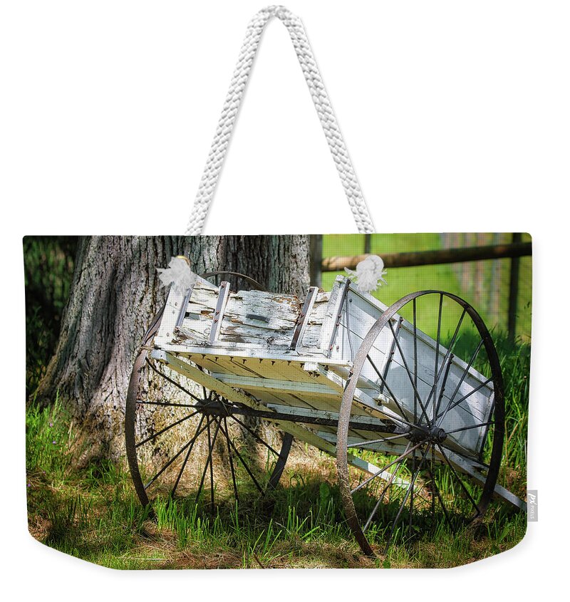Landscape Weekender Tote Bag featuring the photograph Iron Wheels by Scott Burd