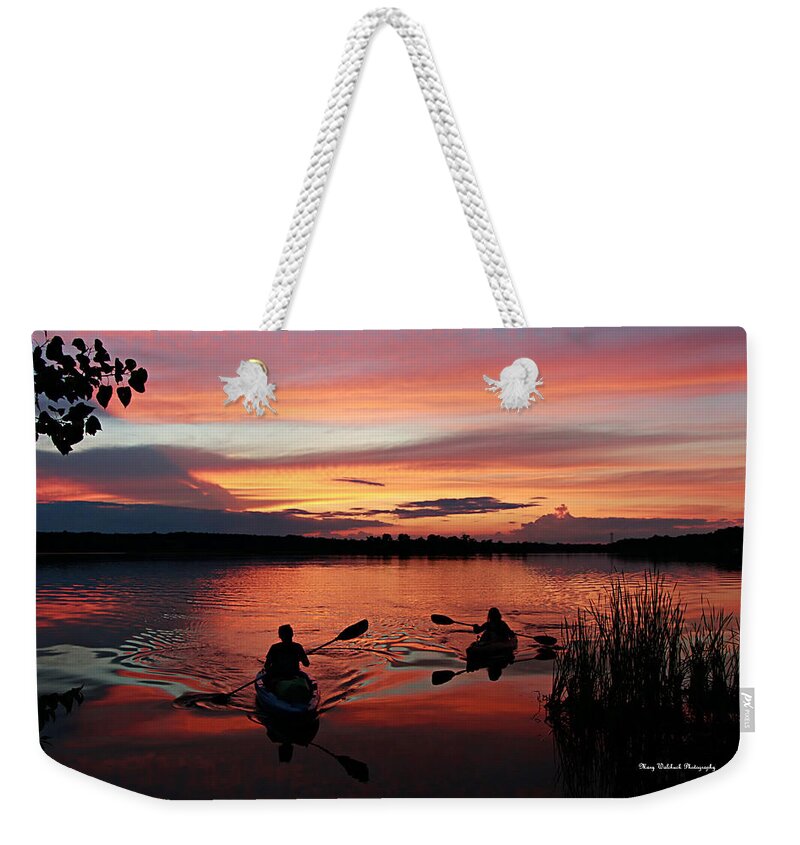 Kayaks At Beautiful Nimisila Reservoir In The City Of Green Weekender Tote Bag featuring the photograph Kayaks at Red Sunset by Mary Walchuck