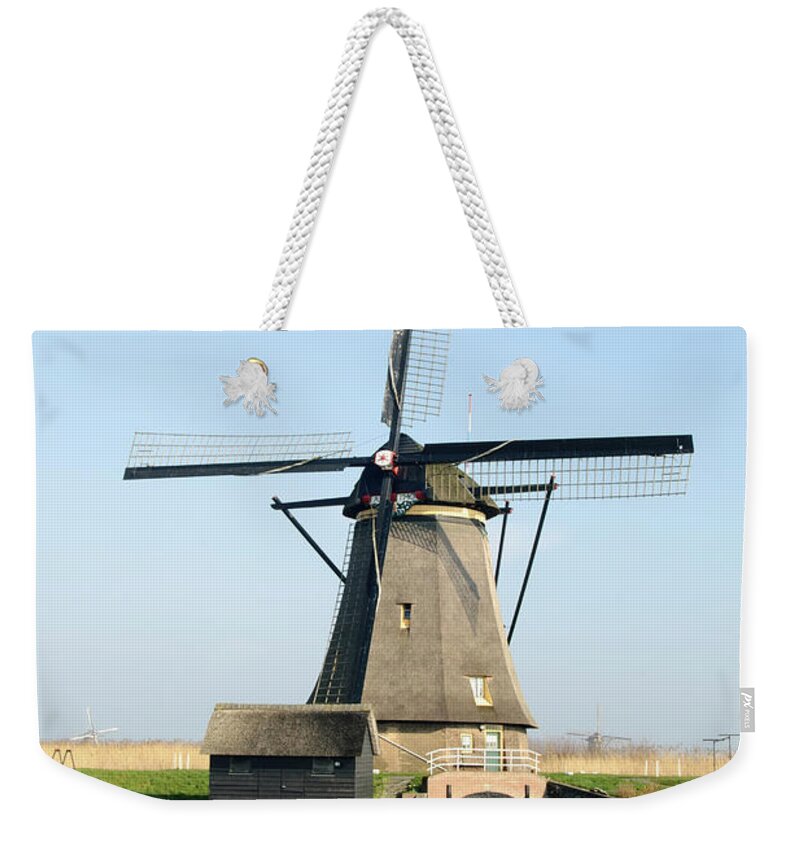 Windmill Weekender Tote Bag featuring the photograph Kinderdijk Windmill by Jan Luit