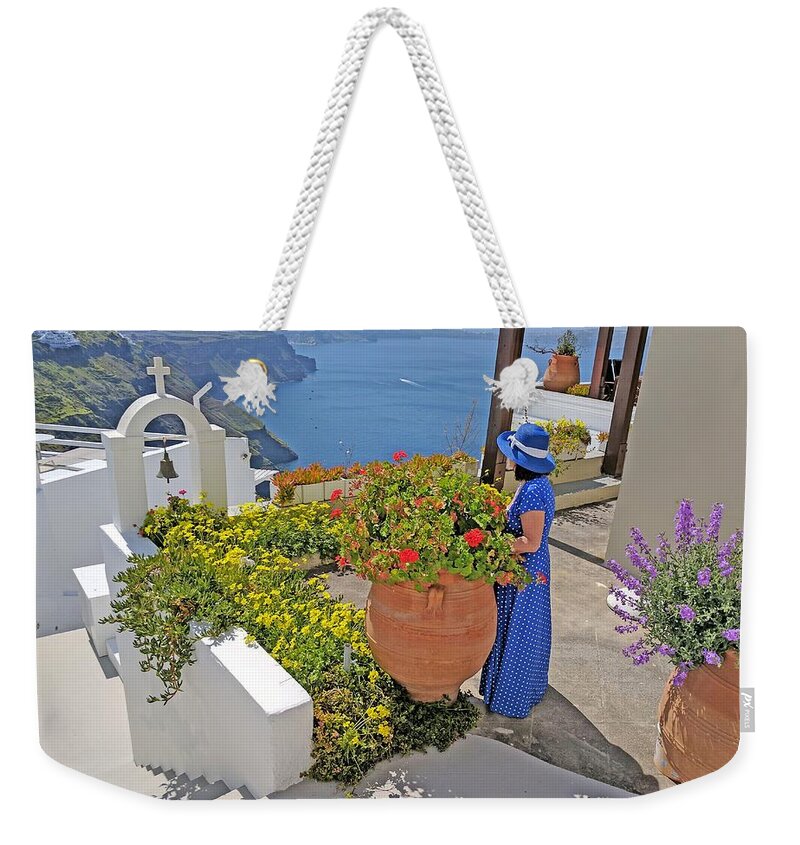 Santorini Weekender Tote Bag featuring the photograph Lady in blue in Santorini by Yvonne Jasinski